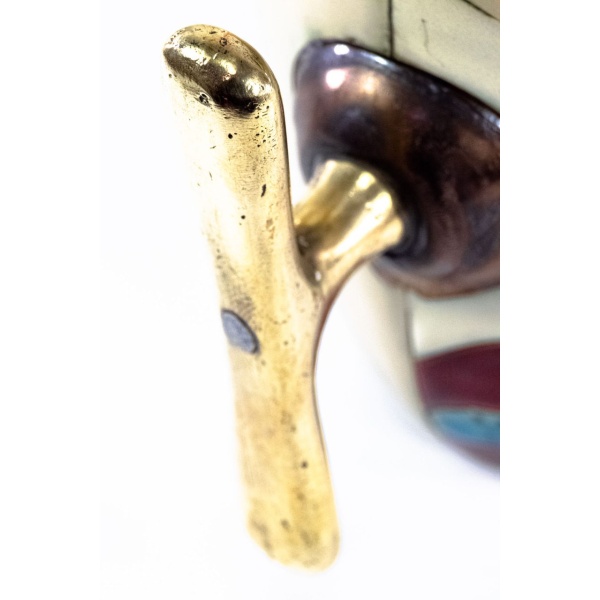 Macro image of handle of antique brass handle of option A.