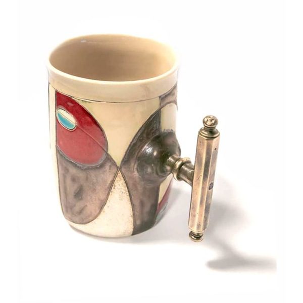 Side View of option "AD". Notice the antiqued brass handle and the design; flowing with a matching copper-brass color, featuring light a single blue symbol on each. this mug is imprinted with an "8".