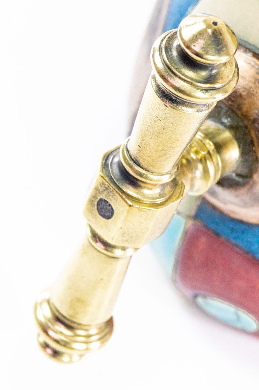 A close-up view of the handle of example A; notice the textural detail in the brass. Again, no two are exactly alike.  Pictured is the distinct handle of "DE"