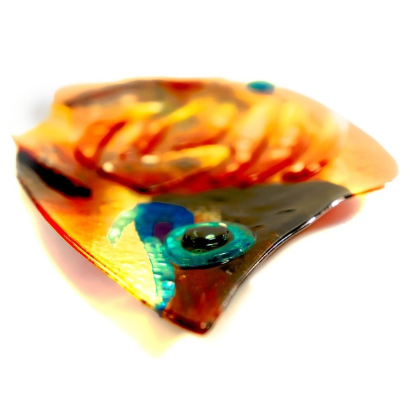 Laying flat as platter, the fused glass tropical fish as viewed intimately, into one another's eyes.