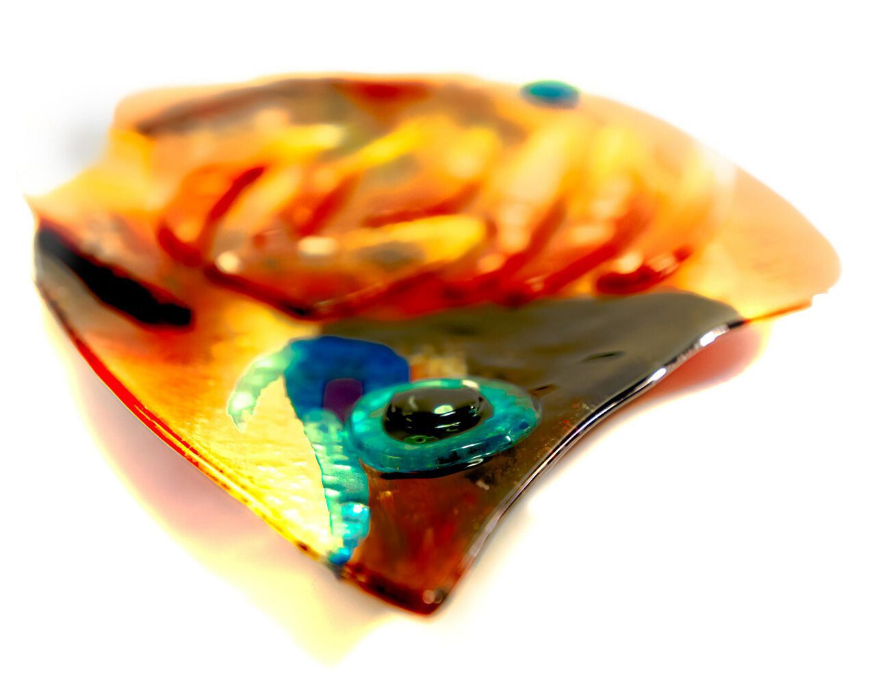 Laying flat as platter, the fused glass tropical fish as viewed intimately, into one another's eyes.