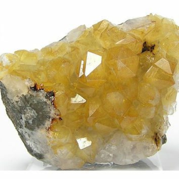 Natural yellow citrine quartz. Compare it to the soap rock.