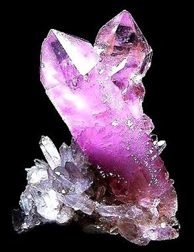 A natural amethyst crystal. Compare it to the soap rock.